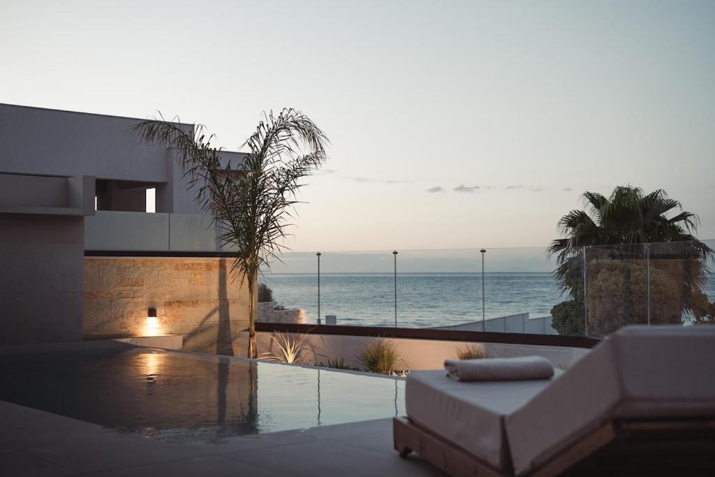 a view of the ocean from a house at Orien, Seaside Luxury Villa in Argassi