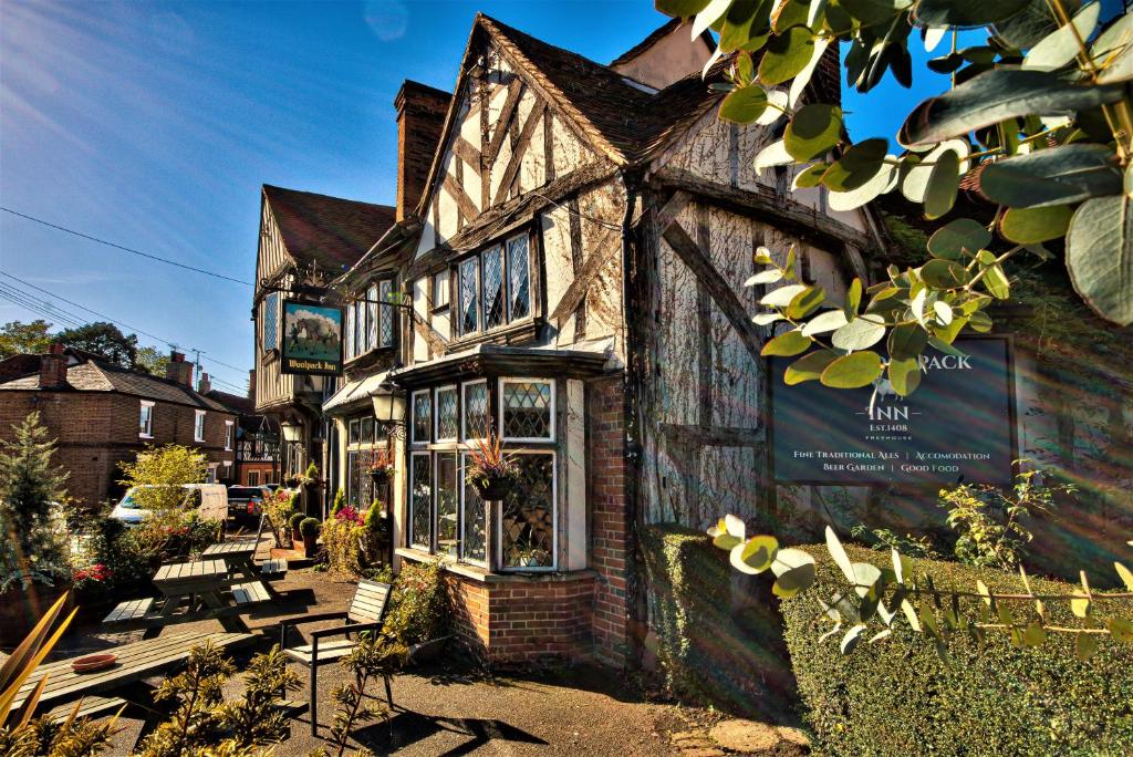 an old building with a sign in front of it at The Woolpack Inn in Coggeshall