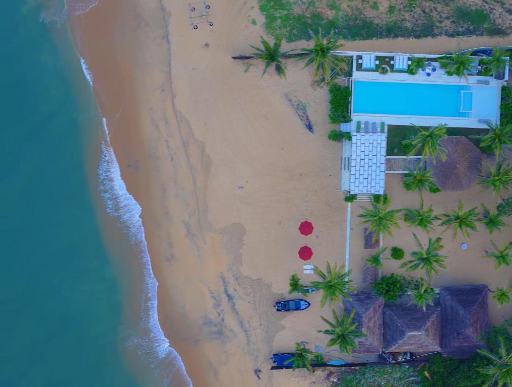 an aerial view of a house on a beach at Dolphin Beach Resort - Dolphines, Kitesurfing & Wildlife in Kalpitiya