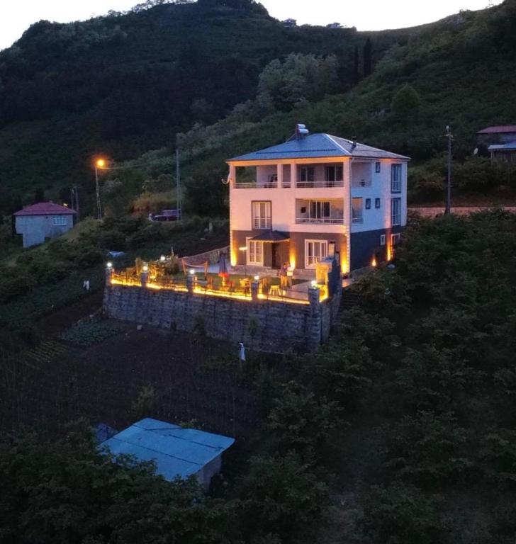 a large house with lights in front of it at Villa Deluxe Panorama 61 in Trabzon