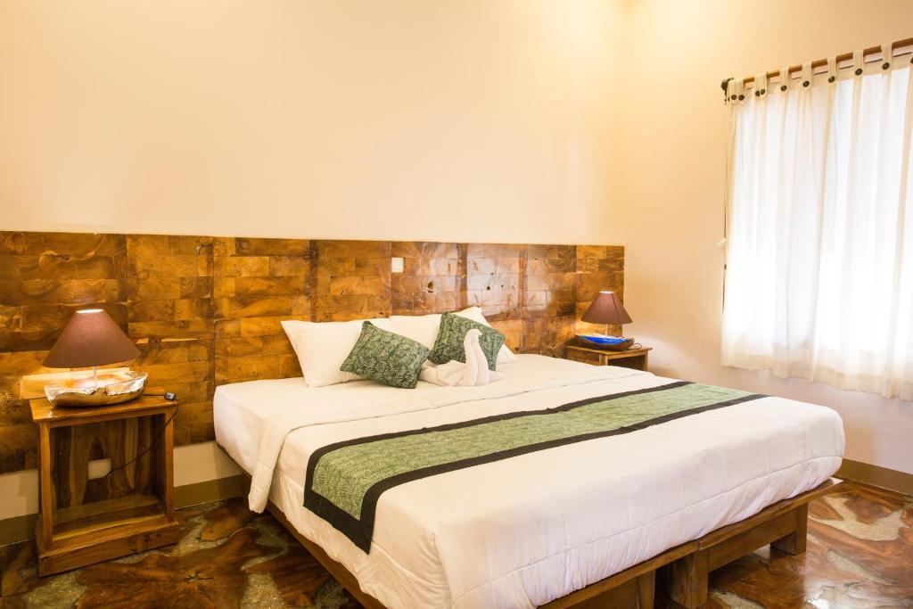 Postel nebo postele na pokoji v ubytování Bulan Bali Homestay