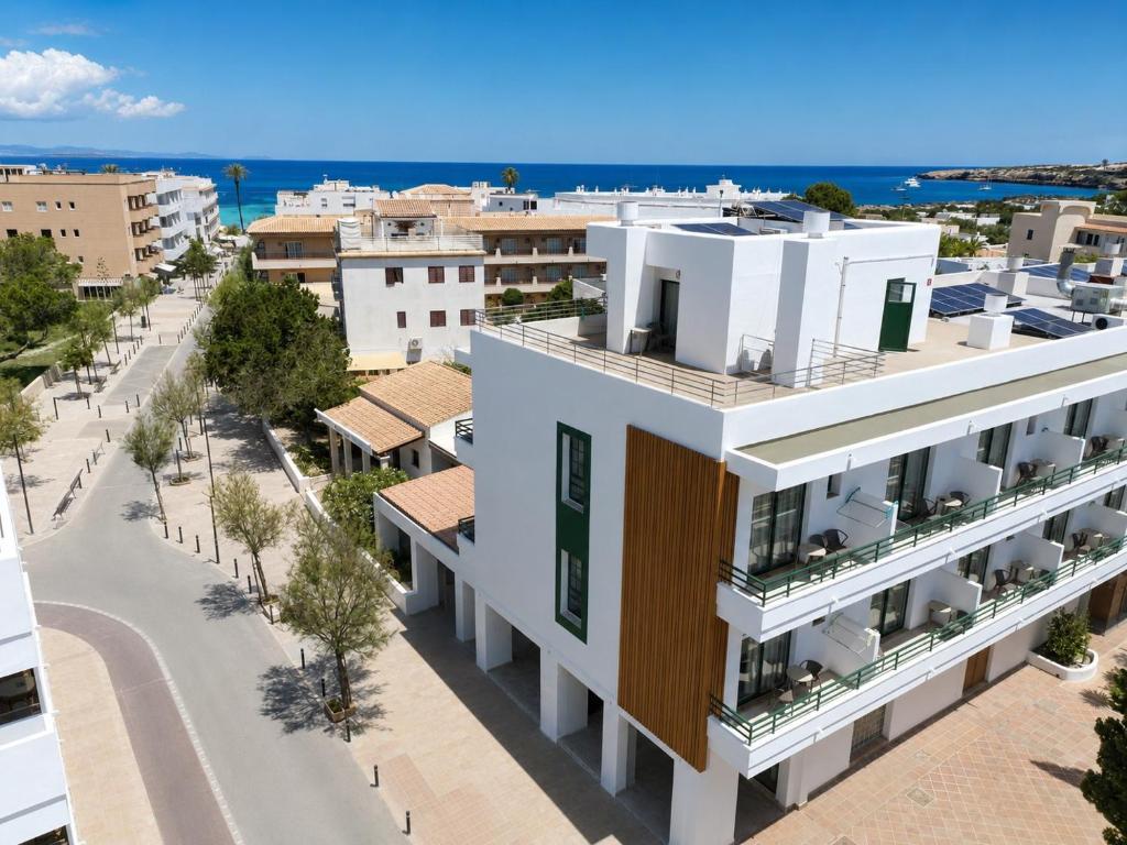 an aerial view of a building with a street at Hotel Rosales Formentera in Es Pujols