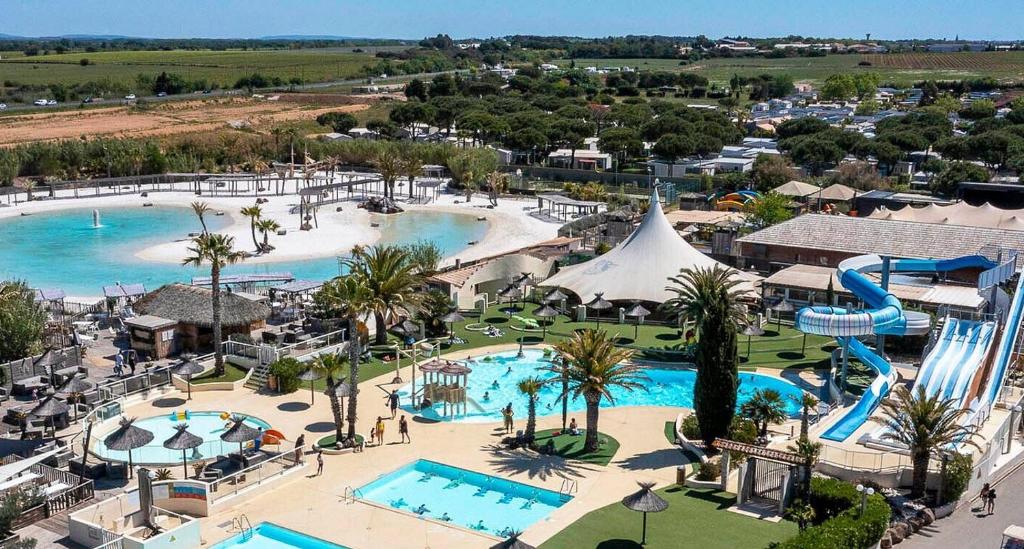 an aerial view of a resort with a water park at Chalet La Dragonniere in Vias