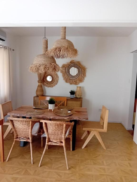 a dining room with a table and chairs at Empa Residence with private pool in Emba