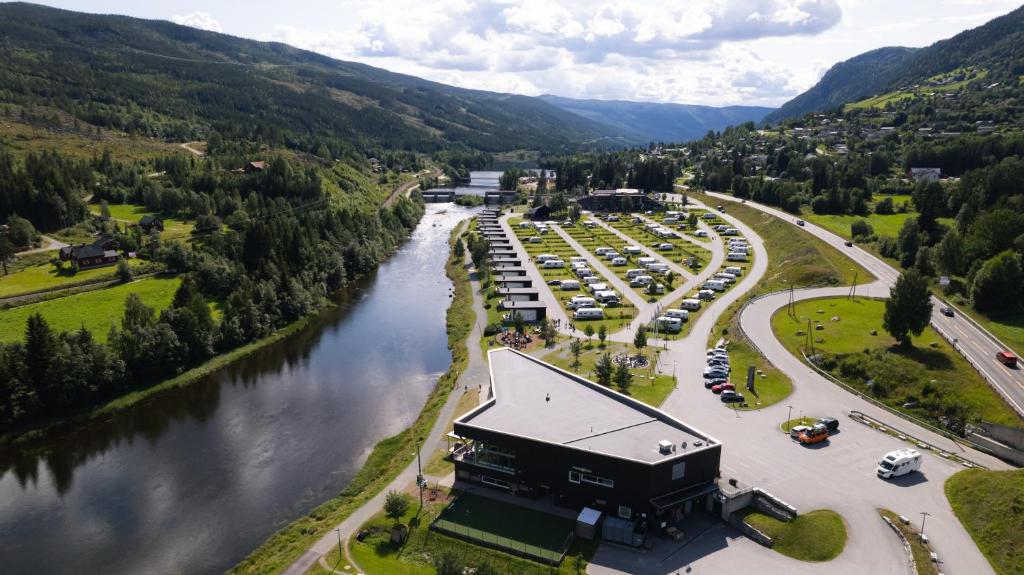an aerial view of a parking lot next to a river at Topcamp Hallingdal - Ål in Al