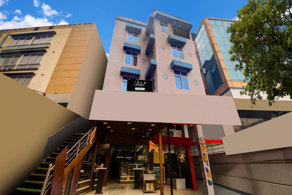 a building with a store in front of it at Super Collection O Sixmile Guwahati Formerly Hotel Gangotri in Guwahati