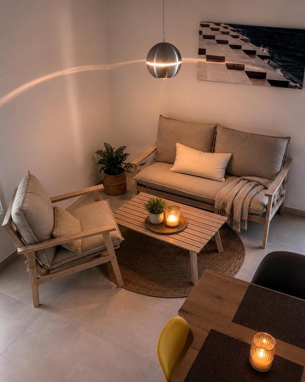 a living room with a couch and a table at Apartment Bunja No3 in Drage