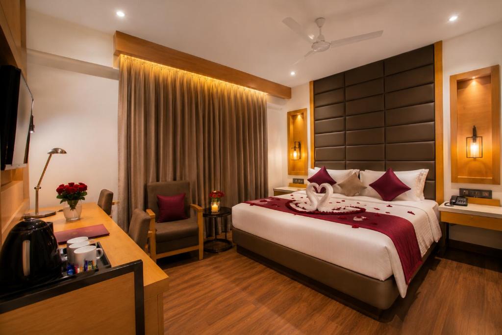 a hotel room with a bed and a desk at Varju Villa in Udaipur