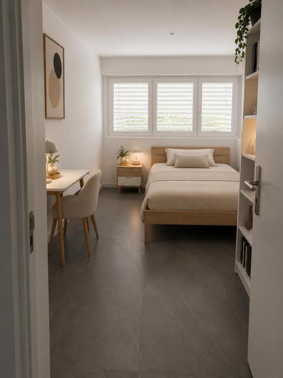 a bedroom with a bed and a table and a desk at Montebello in Bellinzona