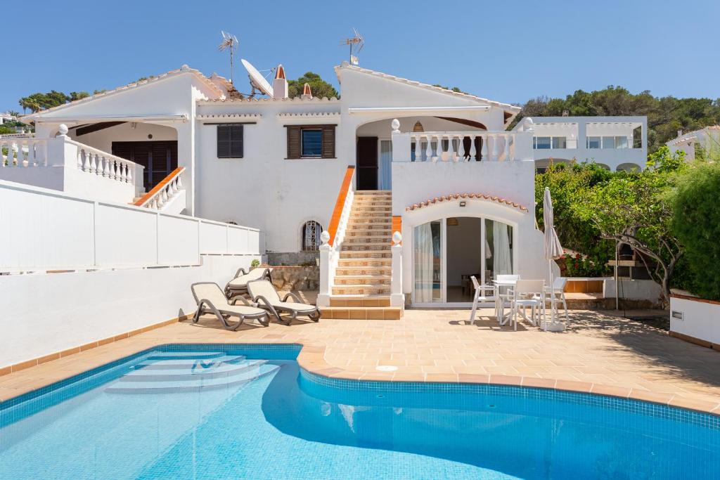 a villa with a swimming pool and a house at V110B Villa La Pau in Son Bou