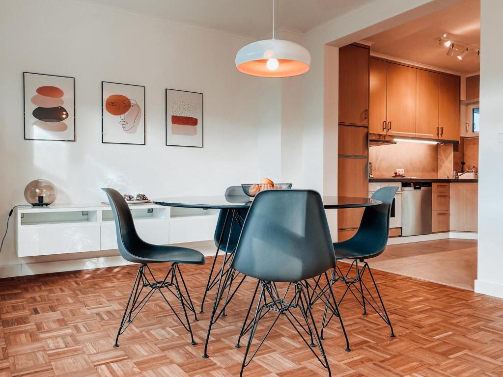 a dining room with a table and four chairs at Casa Bonita in Heikendorf