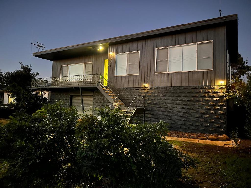 a house with a staircase leading up to it at Olivers Home in Forbes