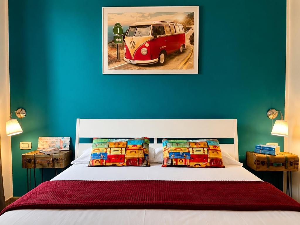 a bedroom with a bed with a van painted on the wall at Domus Rubra in Castelsardo