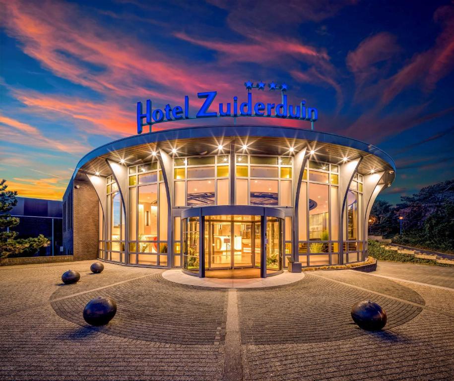 a building with a sign on the front of it at Hotel Zuiderduin in Egmond aan Zee