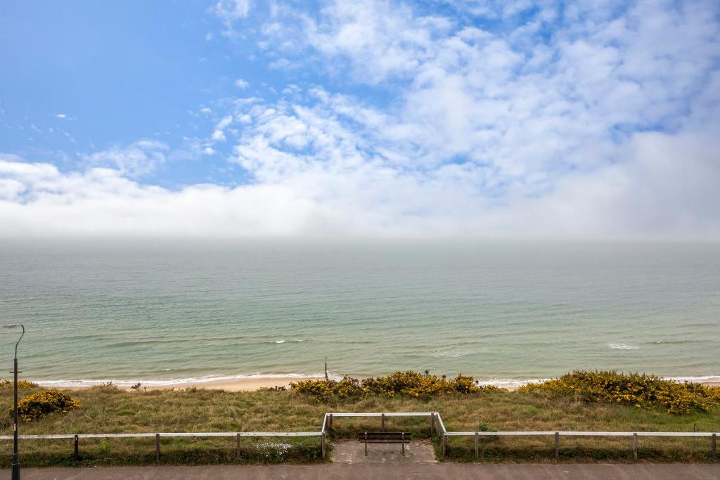 a view of the ocean from a bluff at Seaview apartment in Southbourne