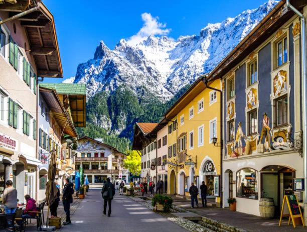 a street in a town with a mountain in the background at Ferienhaus Spornitz in Mittenwald