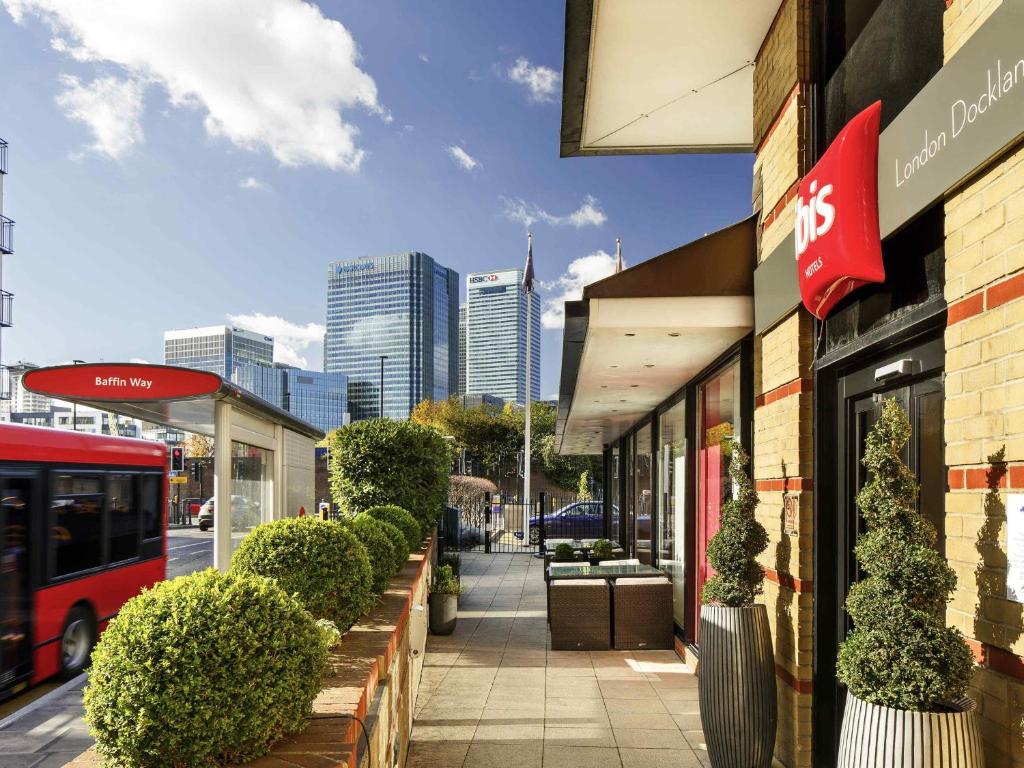 a sidewalk in front of a store with at ibis London Docklands Canary Wharf in London