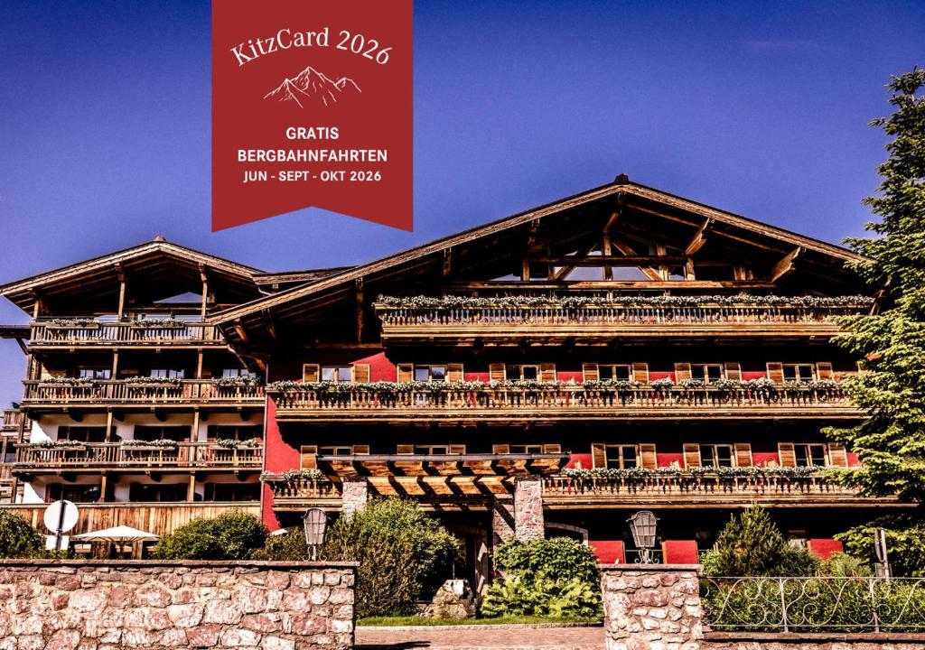 a large building with a large sign in front of it at Kitzhof Mountain Design Resort, 4 Sterne Superior in Kitzbühel