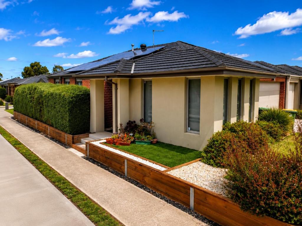 a house with a black roof at Room in Officer in Officer