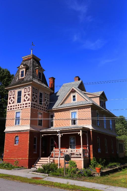 a large house with a tower on top of it at Cheney House Bed & Breakfast in Ashland