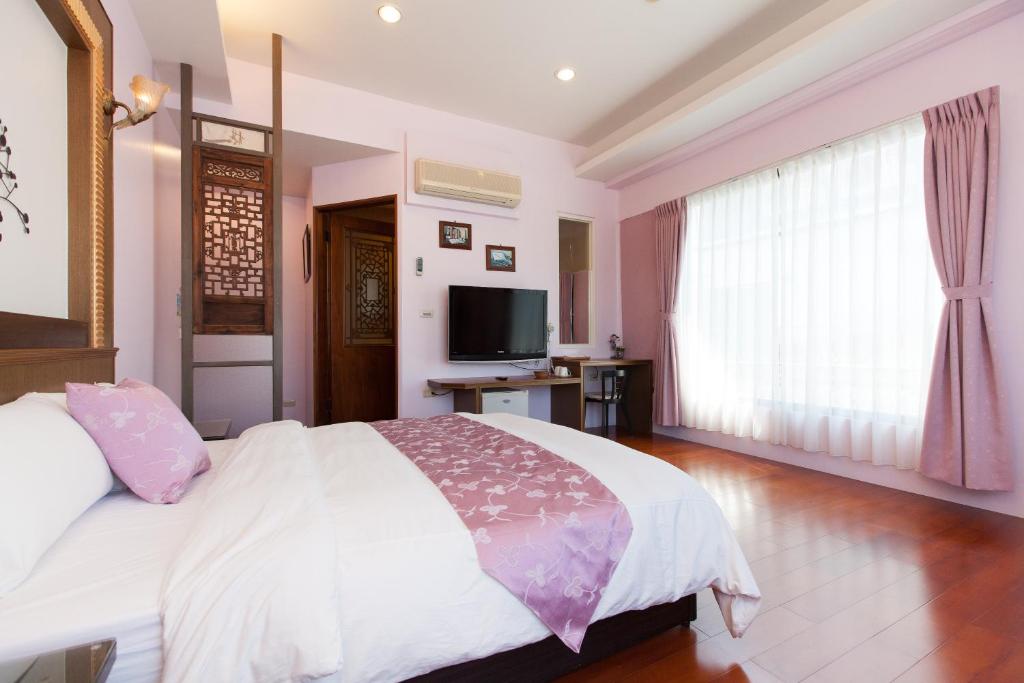 TV a/nebo společenská místnost v ubytování Chun Feng Cao Tang Homestay
