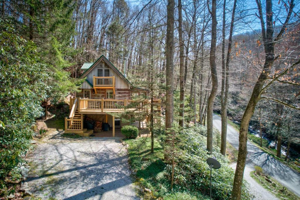 an aerial view of a house in the woods at Creeksong Cabin in Elk Park