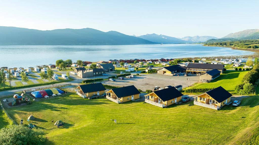an aerial view of a village next to a lake at Topcamp Havblikk - Helgeland in Nesna
