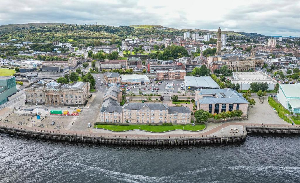 an aerial view of a city next to the water at Ocean Quay in Greenock