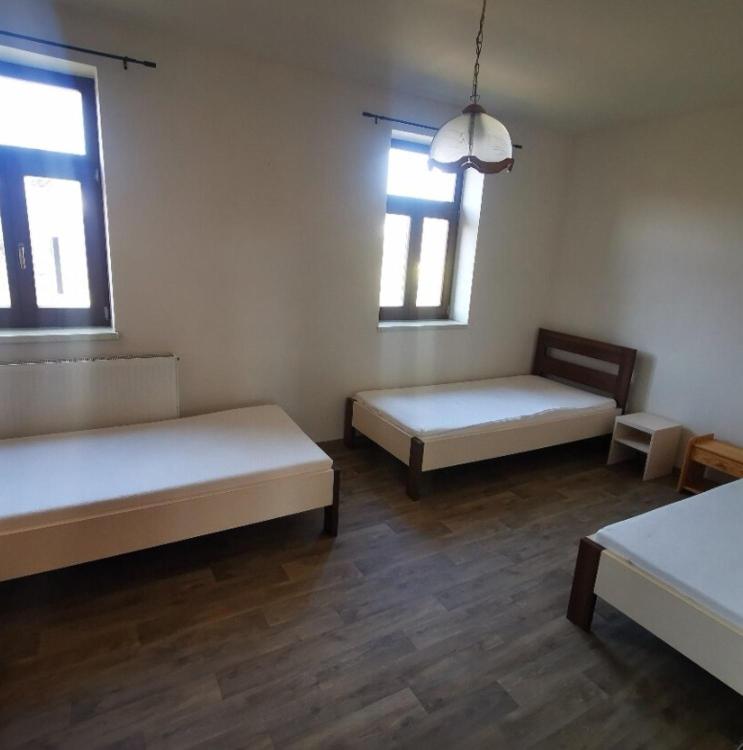 a room with two beds and two windows at Farma Dolní Dvořiště in Dolní Dvořiště