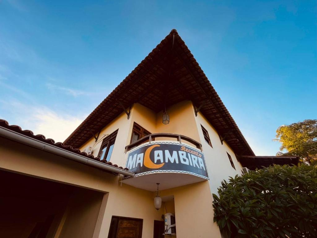a building with a sign on the side of it at Recanto Macambira in Delmiro Gouveia