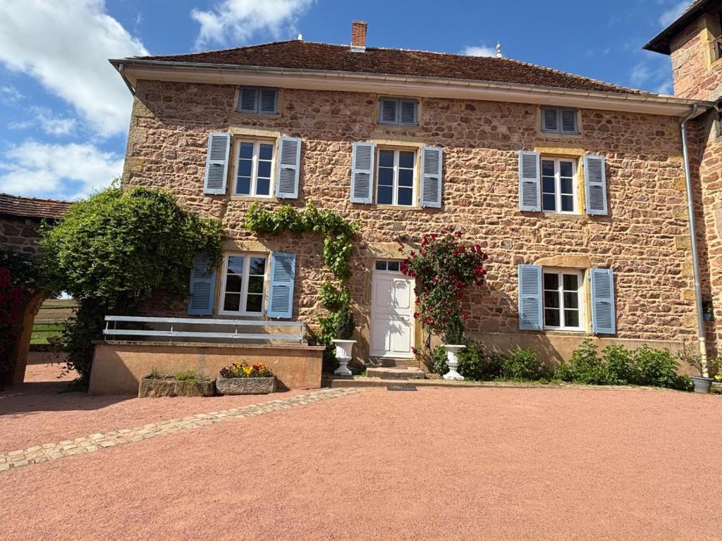 a large brick house with a white door at Clos Lavaux in Châtenay
