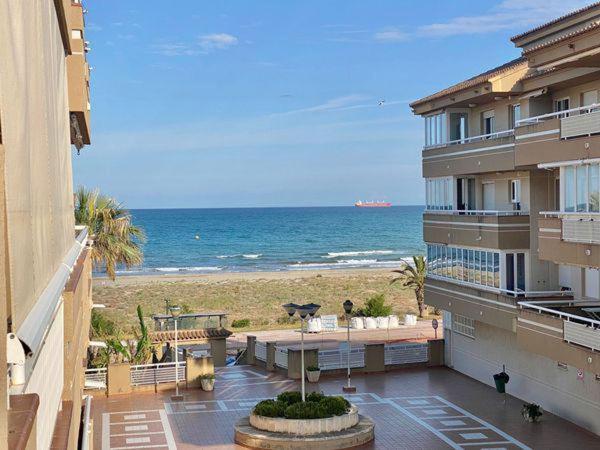 a building with a view of the beach and the ocean at Terra marina in Grao de Castellón