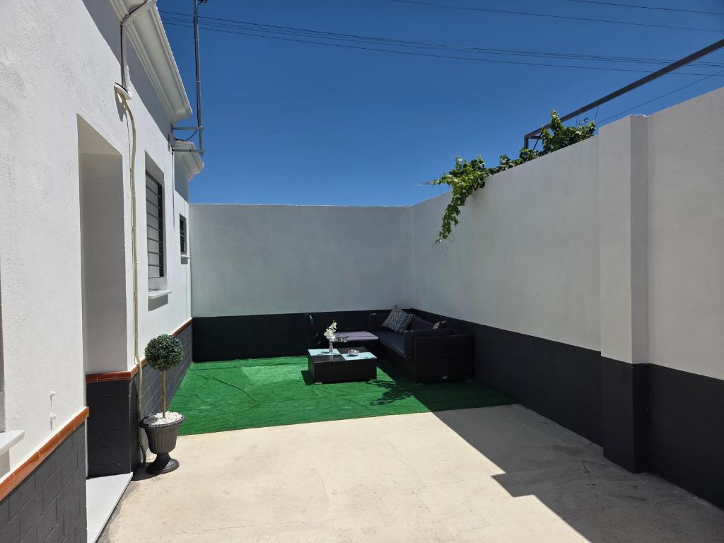 a hallway of a house with a green floor at El Zamora in Sanlúcar de Barrameda