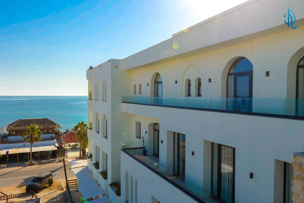 a view of a building with the ocean in the background at Diar Ayoub in Chebba