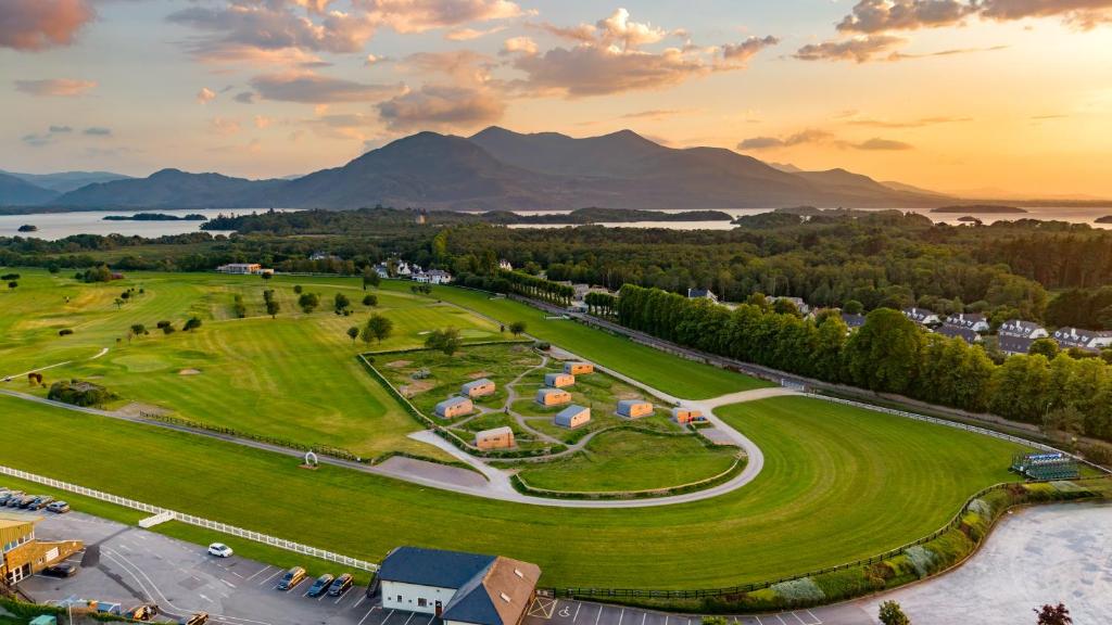 an aerial view of a park with mountains in the background at Killarney Glamping - Ross Road in Killarney