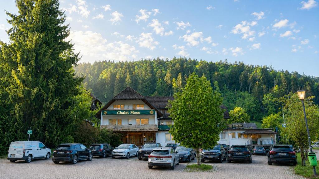 a group of cars parked in front of a building at Chalet MOOS in Todtmoos