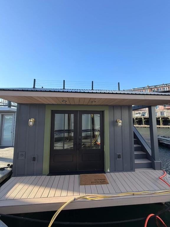 a dock with a door and stairs on a boat at The Wave in Boston