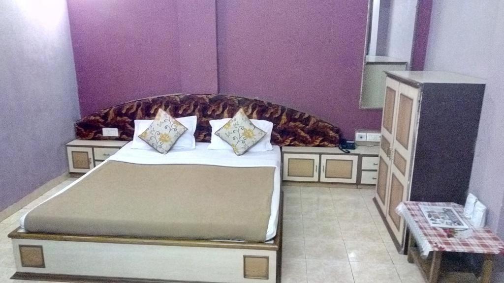 Postel nebo postele na pokoji v ubytování Hotel Damjis