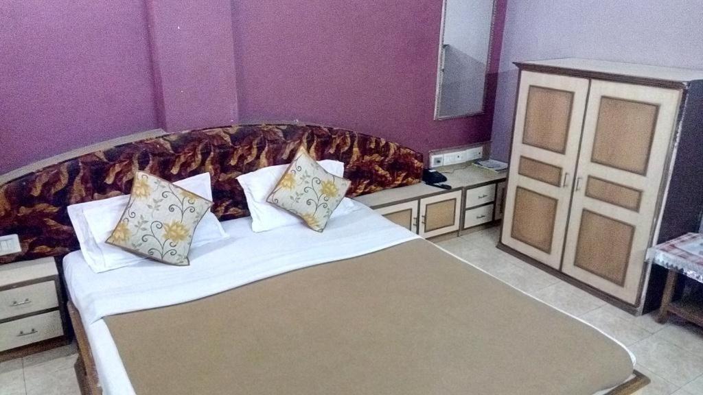 Postel nebo postele na pokoji v ubytování Hotel Damjis