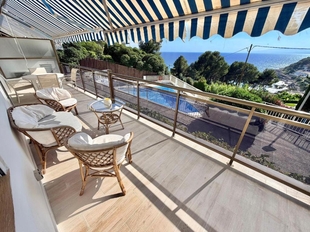 a balcony with chairs and a view of the ocean at Cala Crancs - Sea Views in Salou