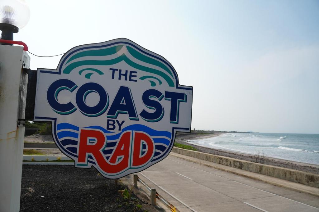 a sign that reads the coast by road at The Coast By RAD in Talisay