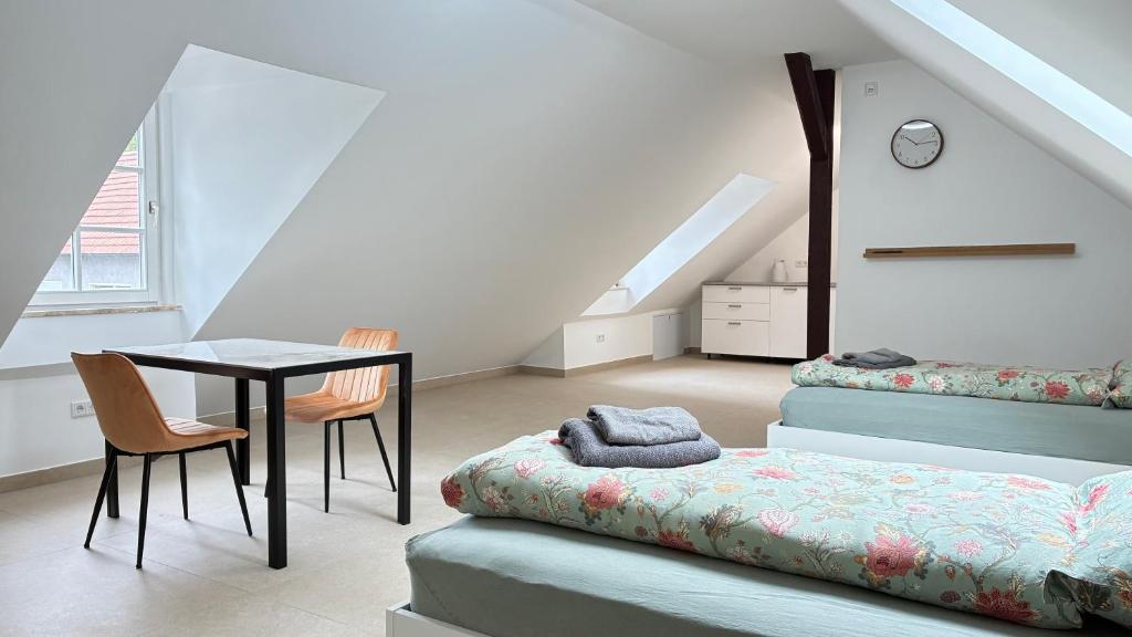 a room with a table and a table and chairs at Atelier überm Hof in Alzenau