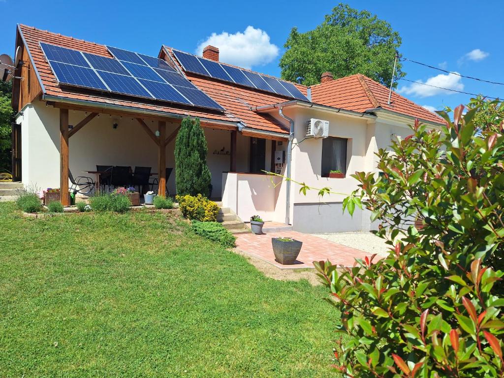 a house with solar panels on the roof at Boglárka Vendégház in Vasvár