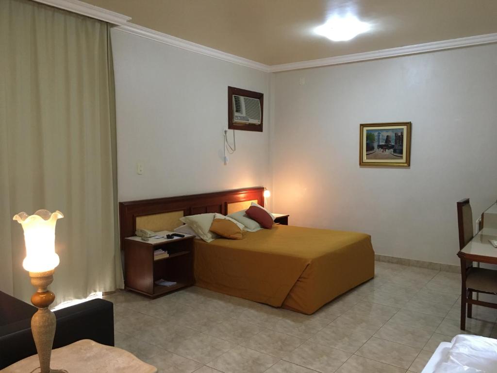Postel nebo postele na pokoji v ubytování Tamareiras Park Hotel