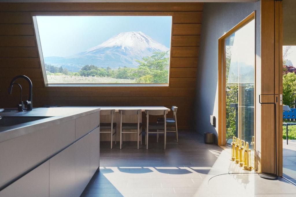 a kitchen with a view of a mountain through a window at THE THIRD PLACE Mt Fuji in Fujikawaguchiko