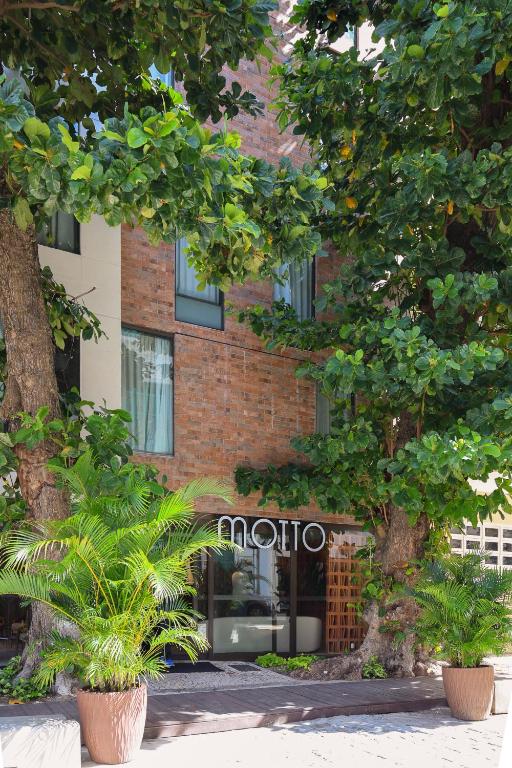 a brick building with a moto sign on it at Motto By Hilton Recife in Recife
