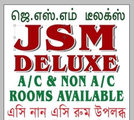 a sign with the words jesrm deluge in red at JSM DELUXE Ac in Vellore