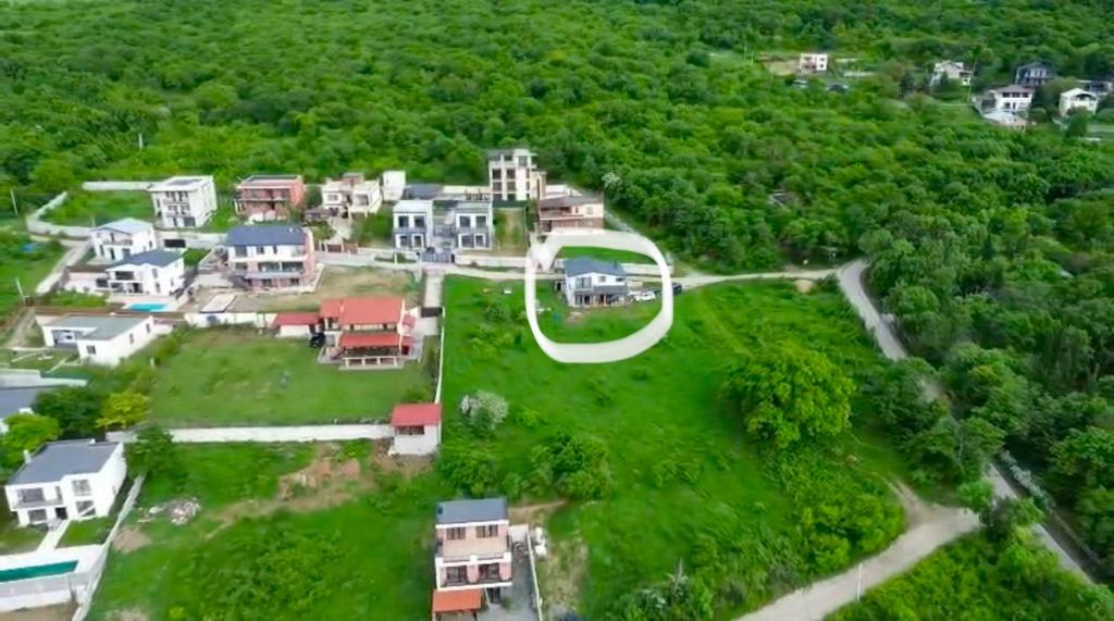 an aerial view of a house in a forest at Guesthouse near Tbilisi in Saguramo