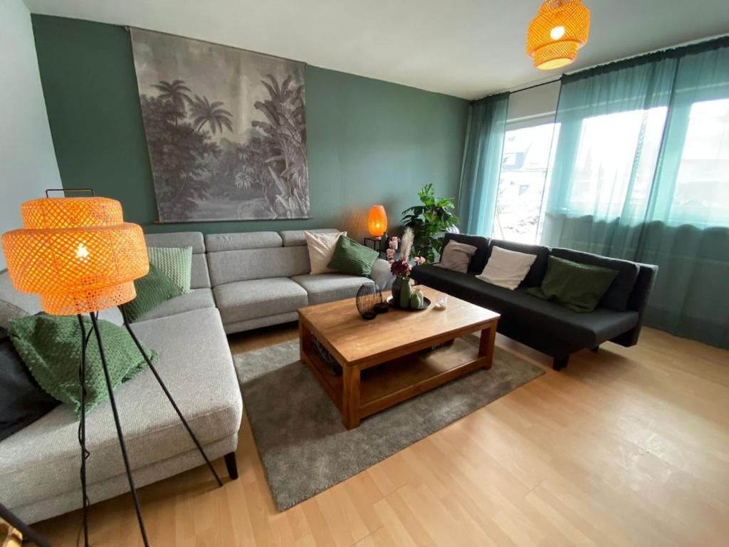 a living room with a couch and a coffee table at Ferienwohnung Sankt Michael in Bad Laasphe
