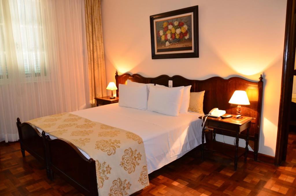 Postel nebo postele na pokoji v ubytování Hotel Glória Resort & Convention